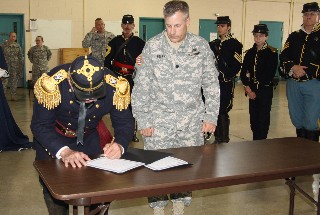 Colonel Henry signs Proclamation